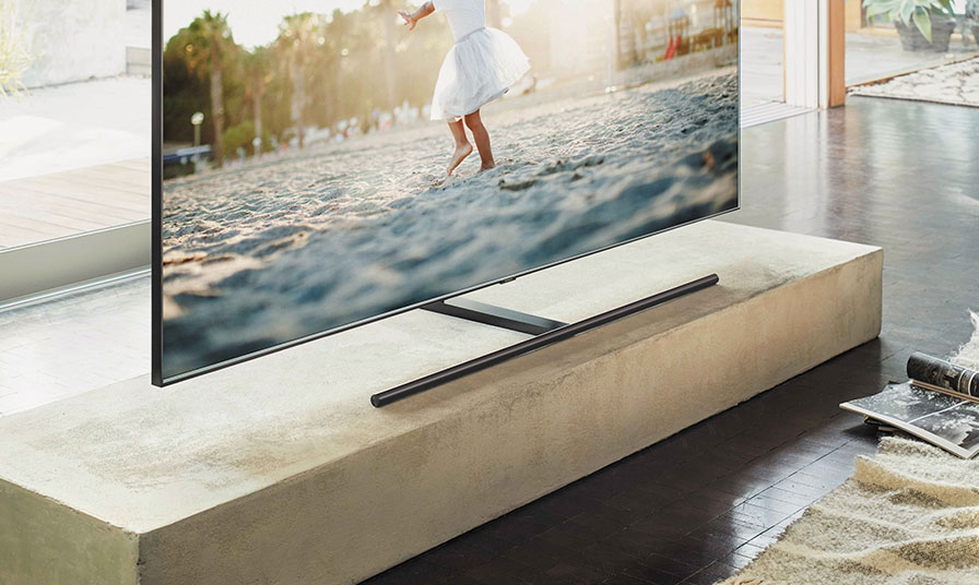 This is an image of the Samsung QLED TV placed on top of a table.