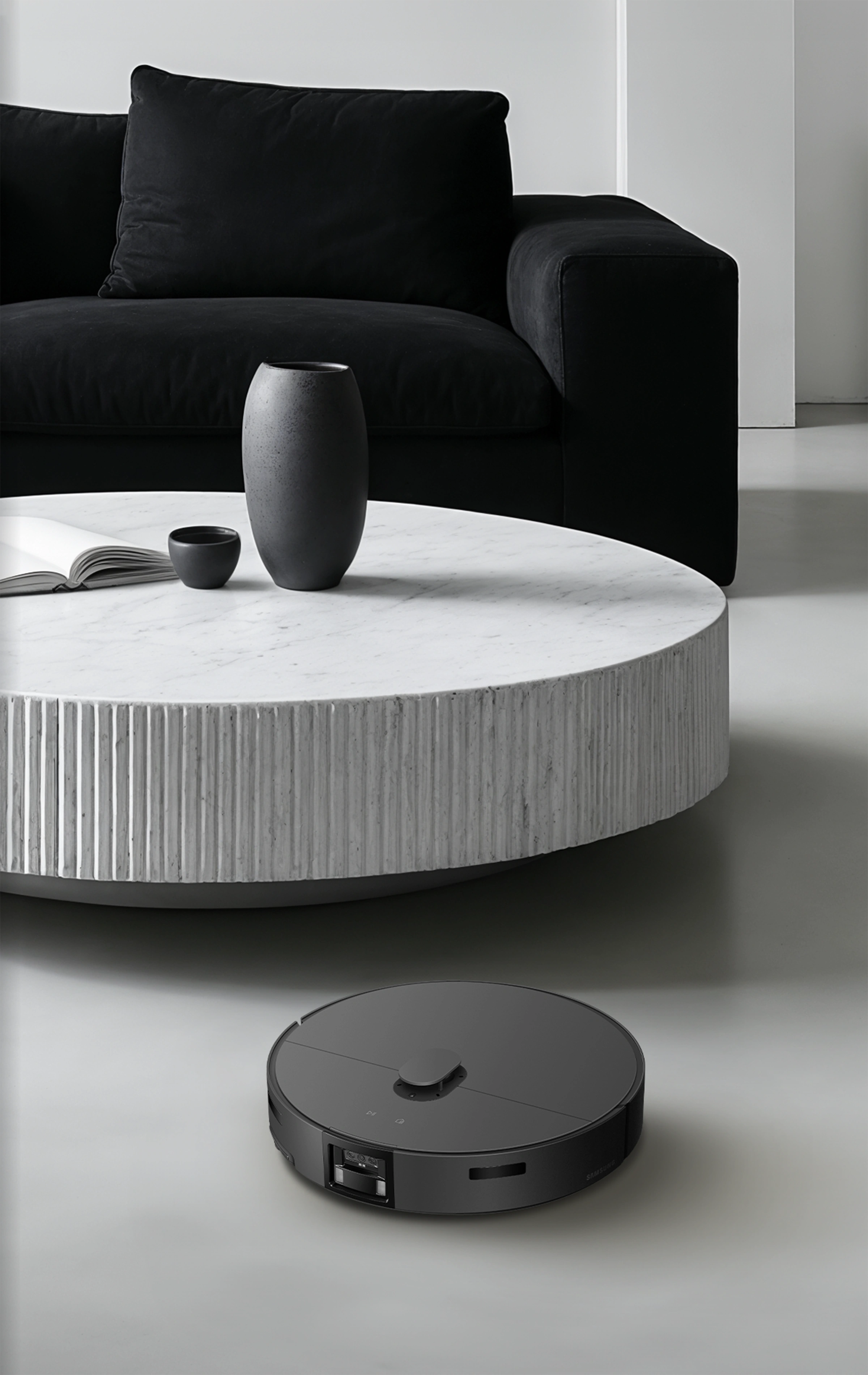 An image of a charcoal-colored product operating in a modern living room.