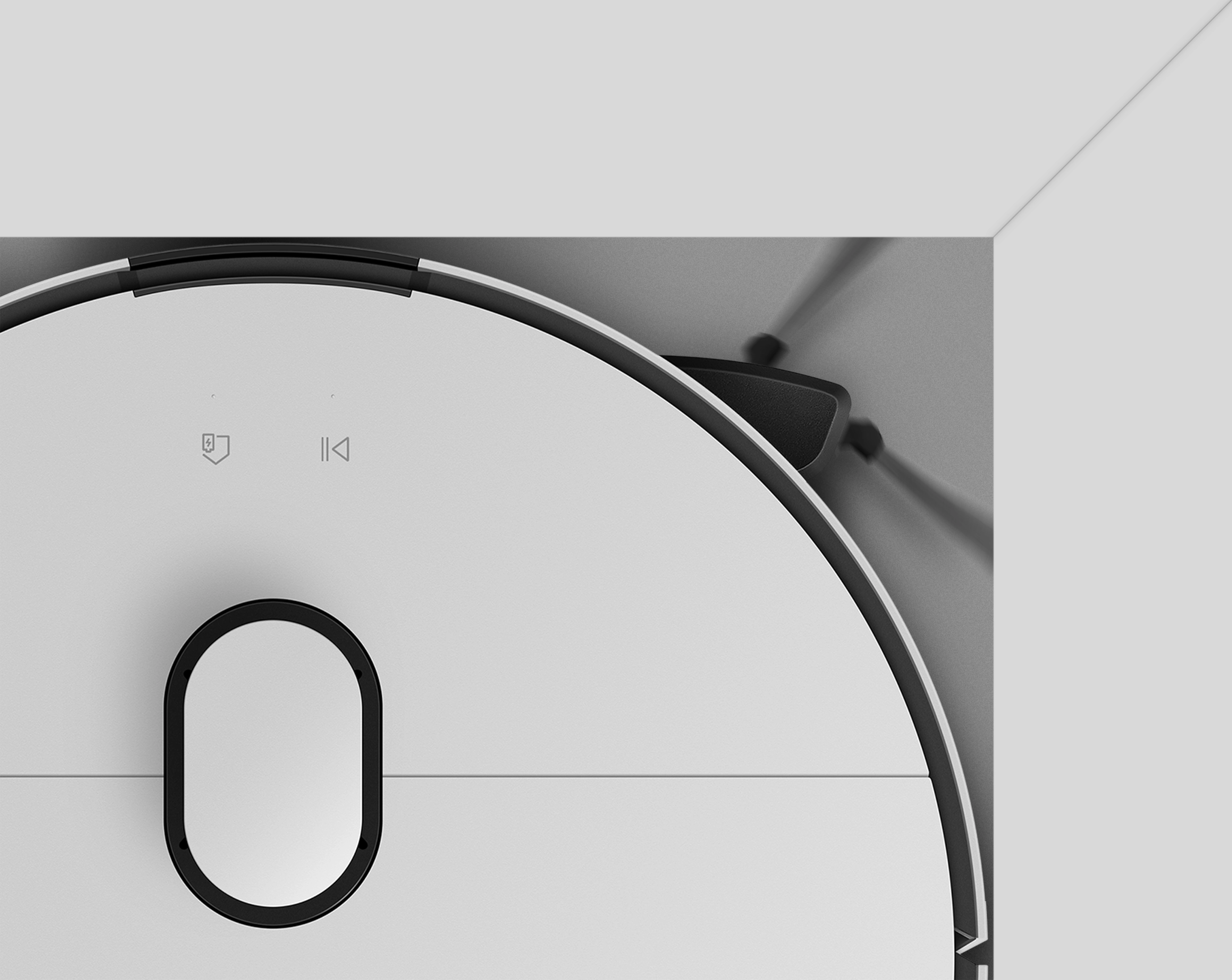 Top view of the Bespoke AI Steam Ultra with the pop-out brush extended toward corners for edge cleaning.