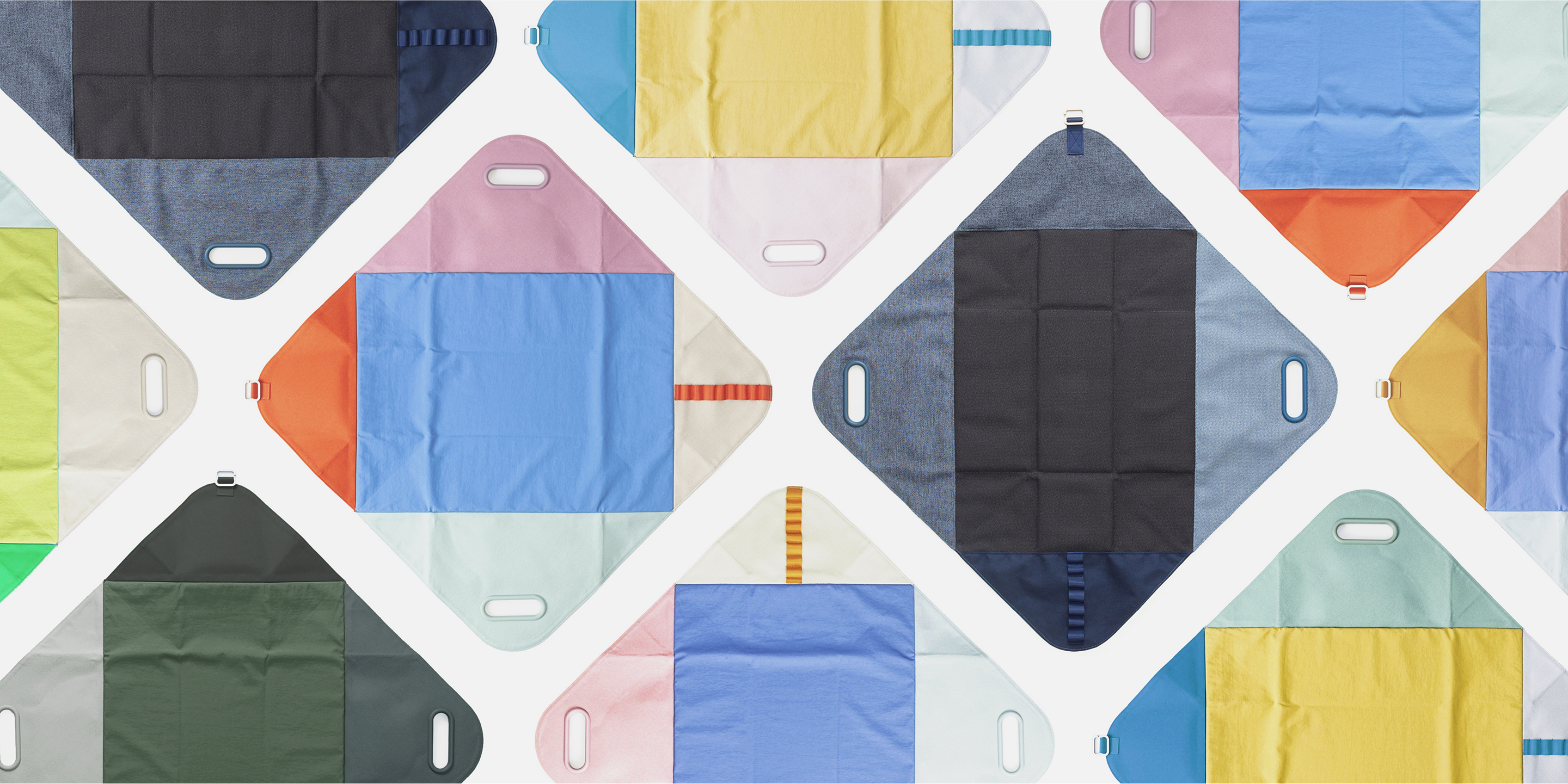 Multiple bojagi backs, each composed of five differently colored panels, arranged in a regular, repeating pattern.