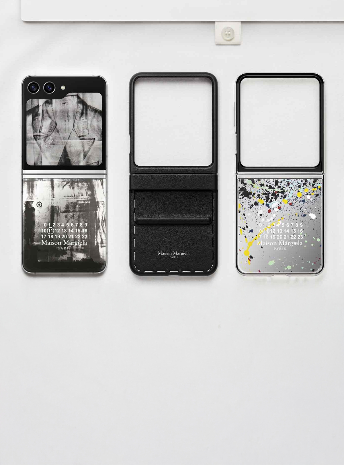 Case images of Maison Margiela's Galaxy Z  Flip Six, from left: an artistic background with signature numbering and neutral brushstrokes, a case with white sweat on black leather, and a case with signature numbering and a background with a scattering of colors. 