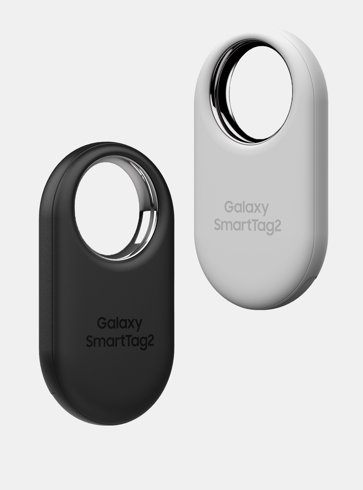 A product image with a small oval design with a large ring-shaped opening at the top. The image shows a black product on the left and a white product floating a little higher up on the right.