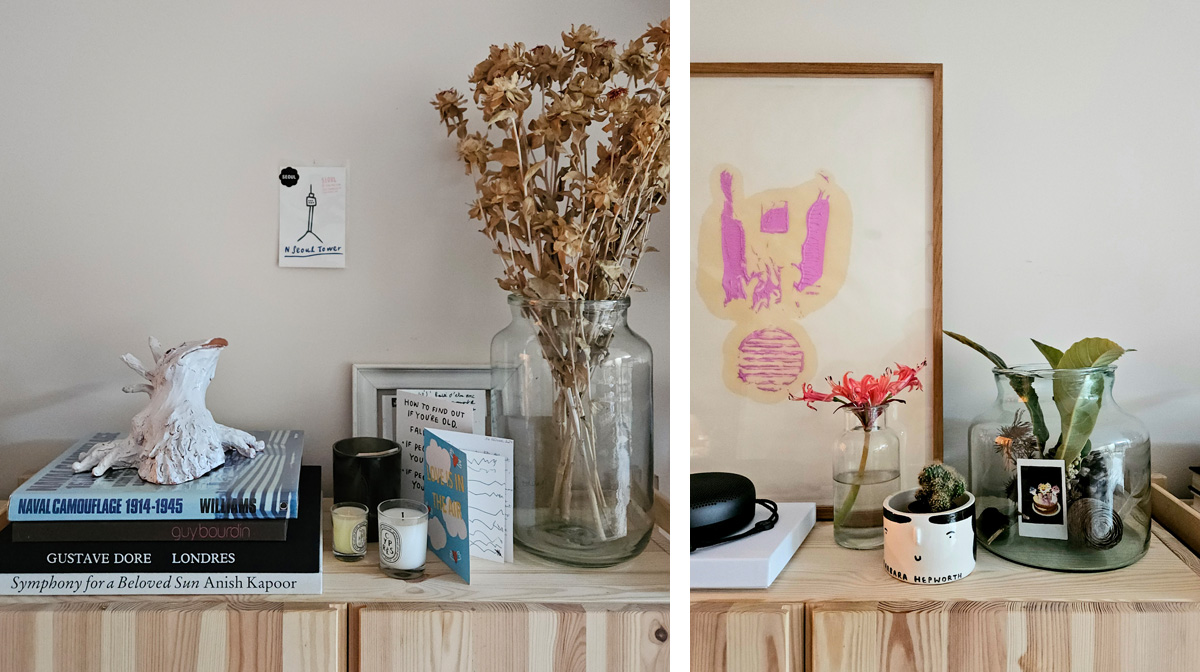 A harmonious arrangement of dried flowers in glass jars, books, and artistic ornaments create.