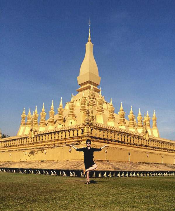 A man standing in front of palace.