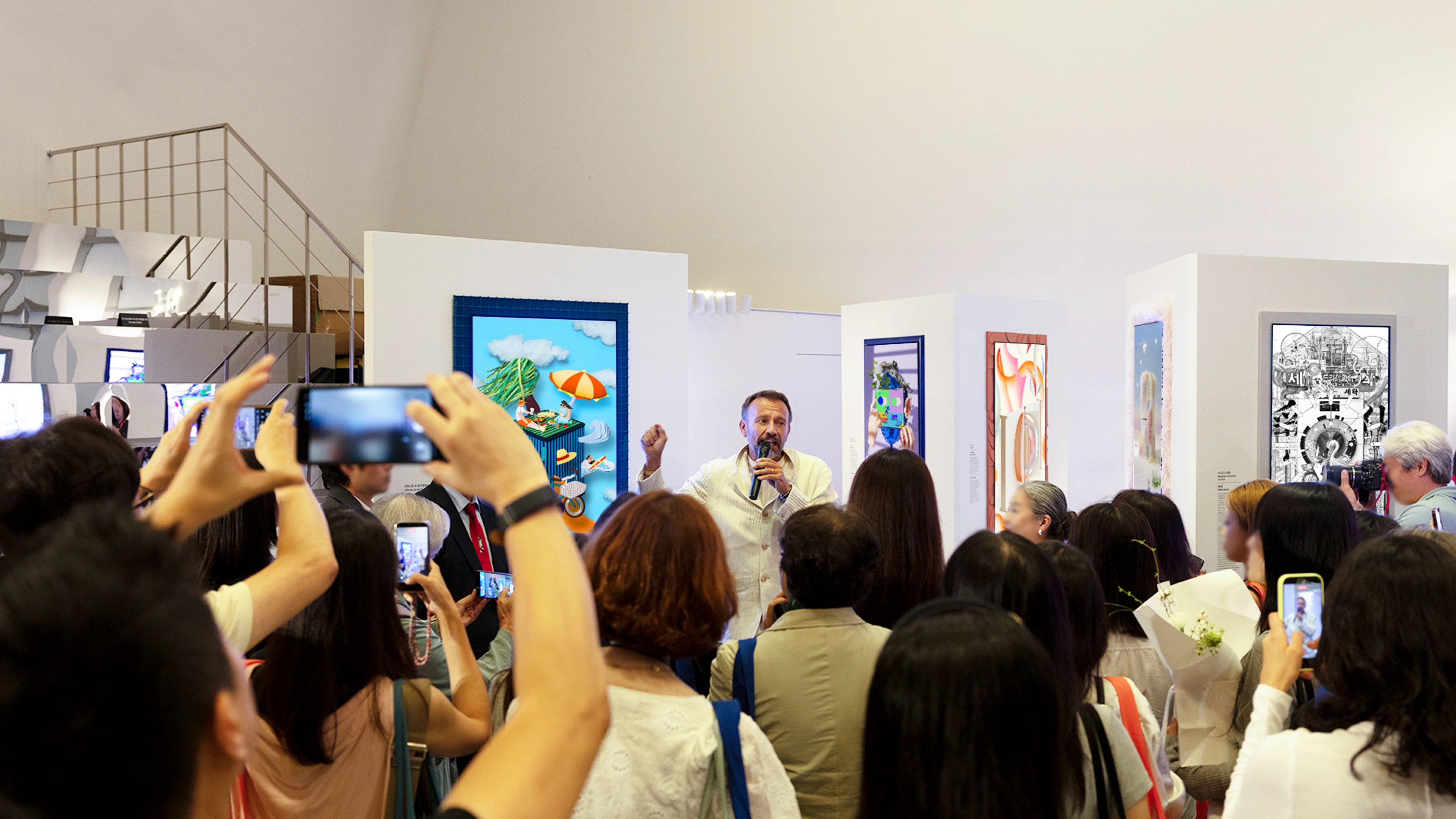 Samsung Design CDO Mauro Porcini delivering a speech to the audience in the exhibition space.