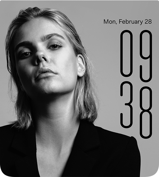A combination of Galaxy Z Flip7 and Z Fold7 watch face screens. From left to right: a long-haired blonde woman, a short-haired woman, a dog lying on grass with its eyes closed, a girl holding a poodle, and a man against a high-contrast black background—each used as a watch face background.