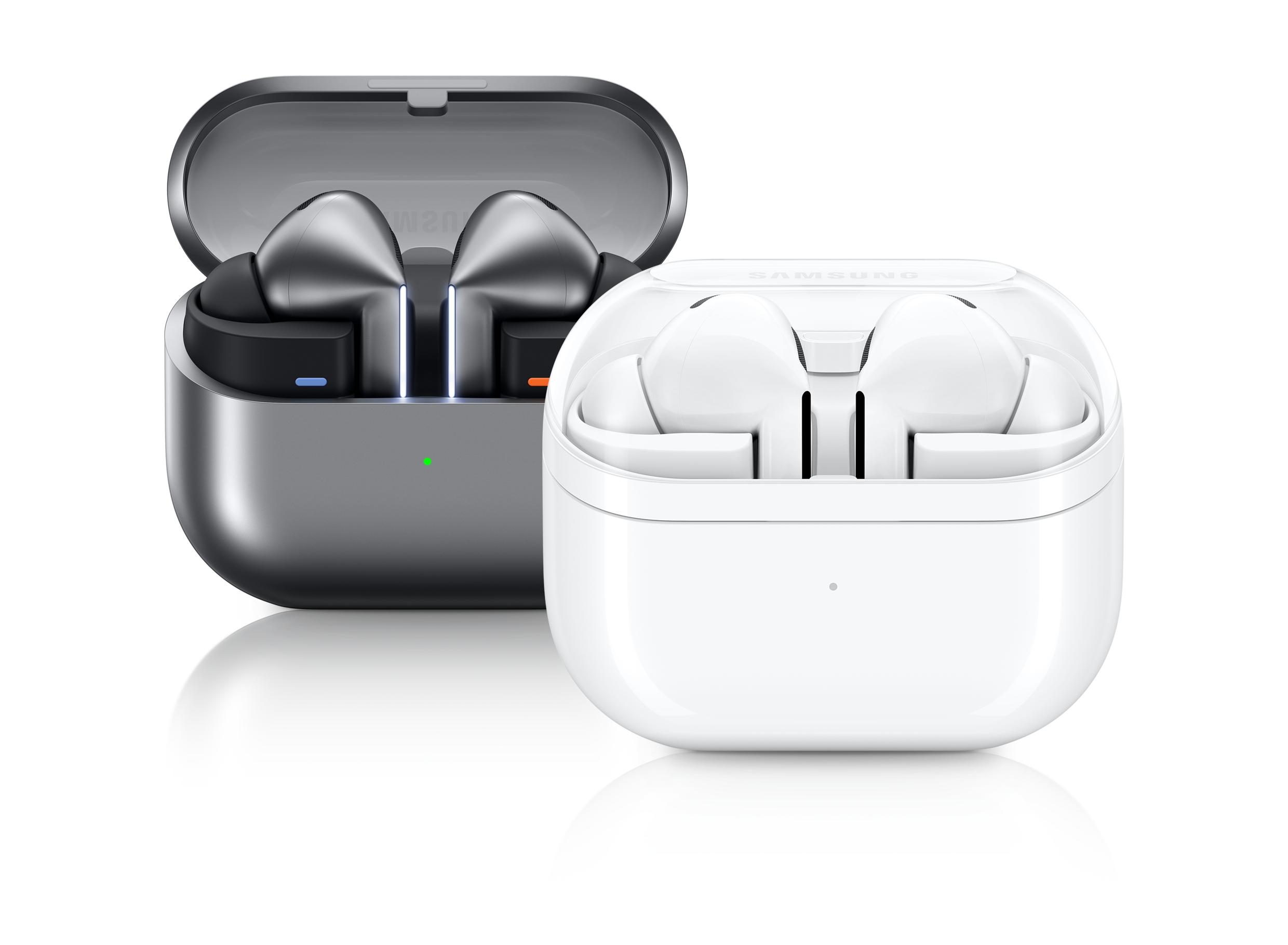 Two color of the Galaxy Buds3 Pro image. The dark gray one on the left and the white one on the right. The dark gray one has the lid of the cradle (case) open. The blades of the Buzz Three Pro are illuminated. The area where the product is inserted is also illuminated on the front in blue on the left and red on the right. The front of the cradle also has a small green light indicating.