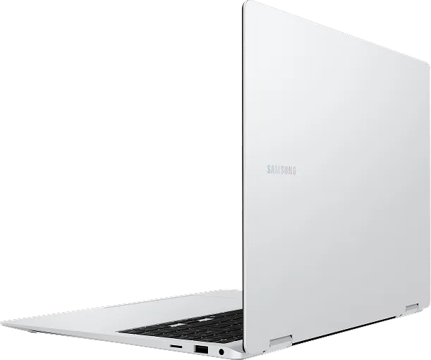 Open white Samsung Galaxy Book laptop displayed against a dark space background.