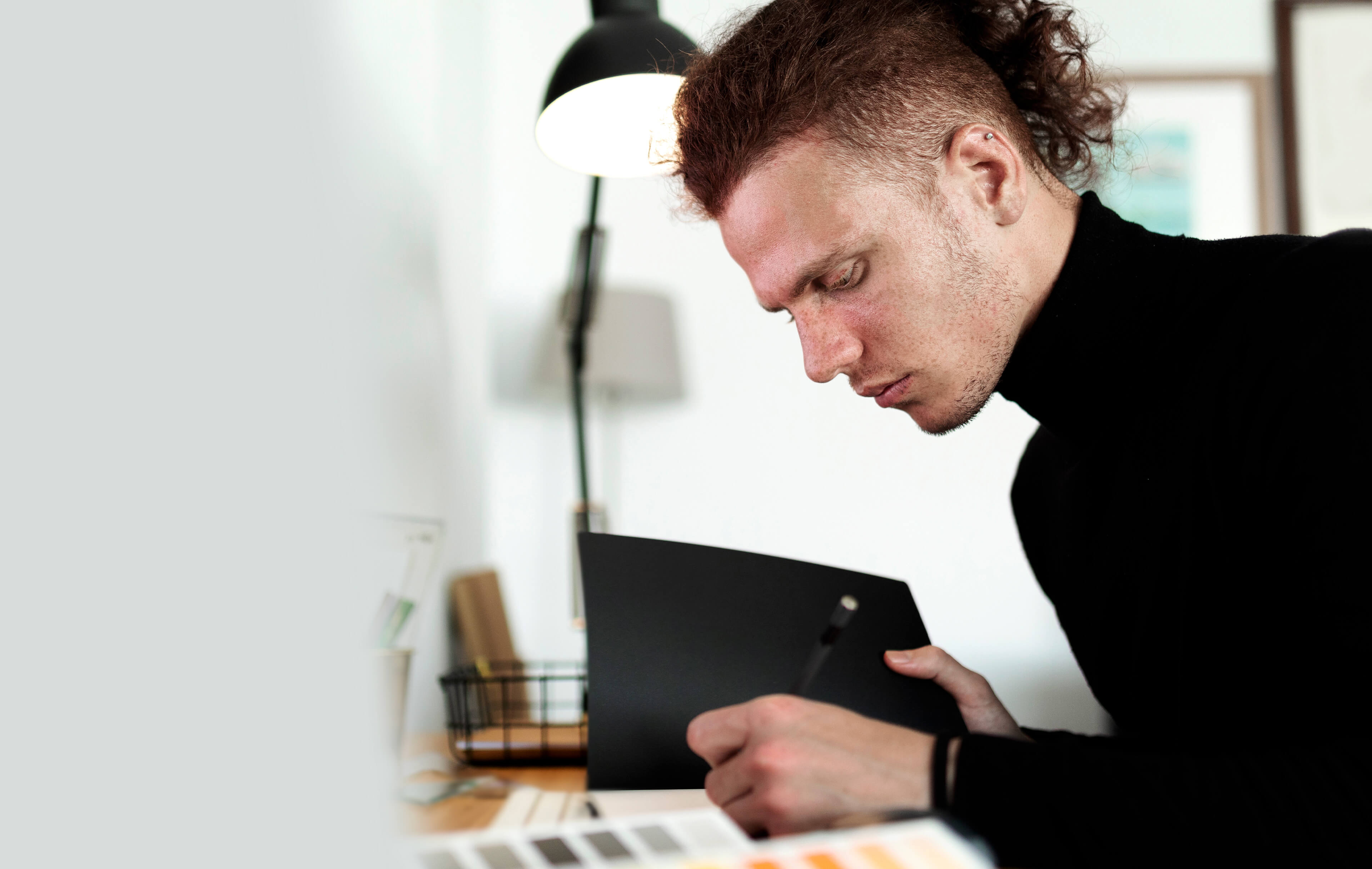 A side view of a young man as a cover image of Work section.