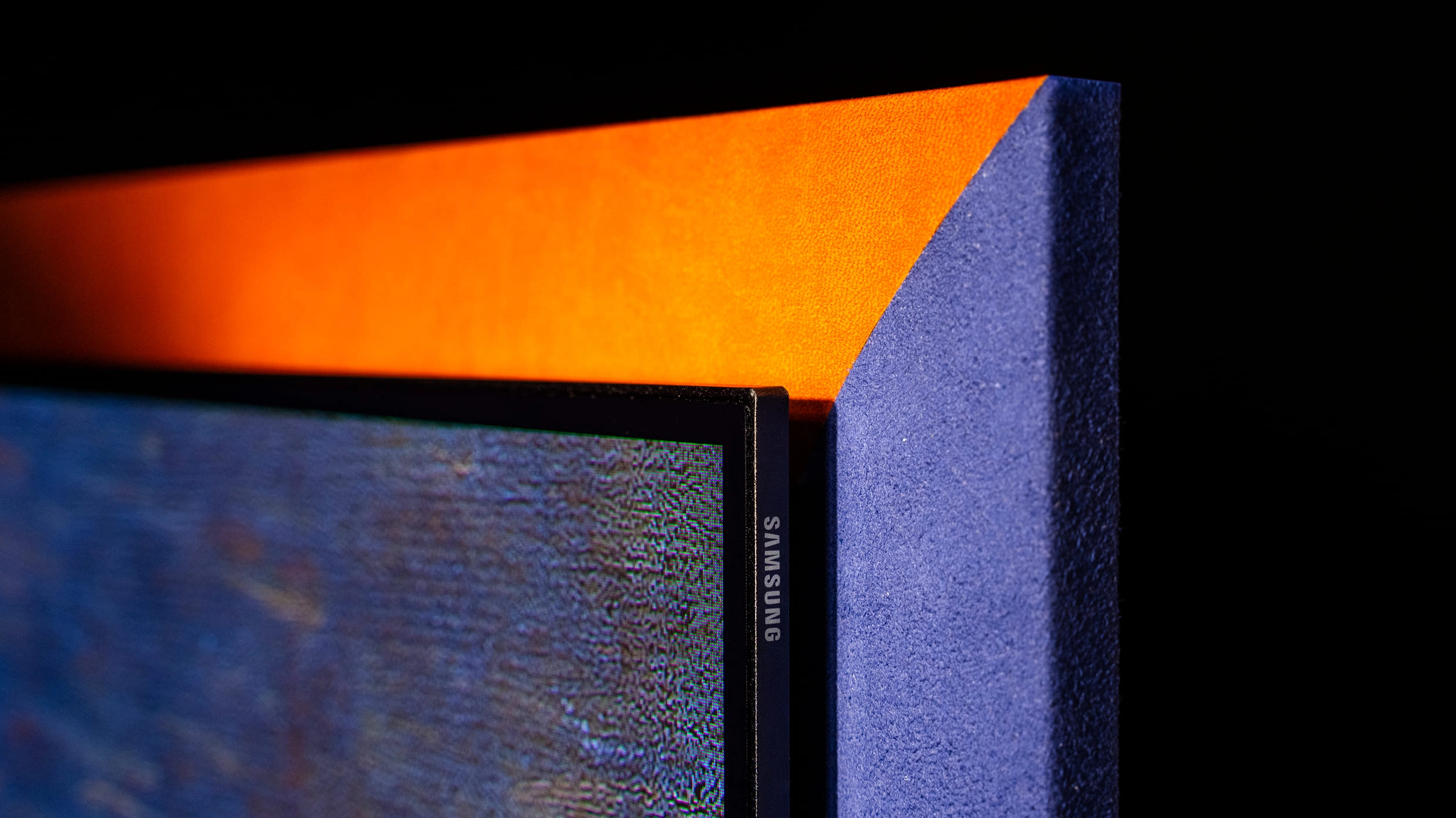 Detail highlighting the different leather textures of the S95H OLED TV color frames.