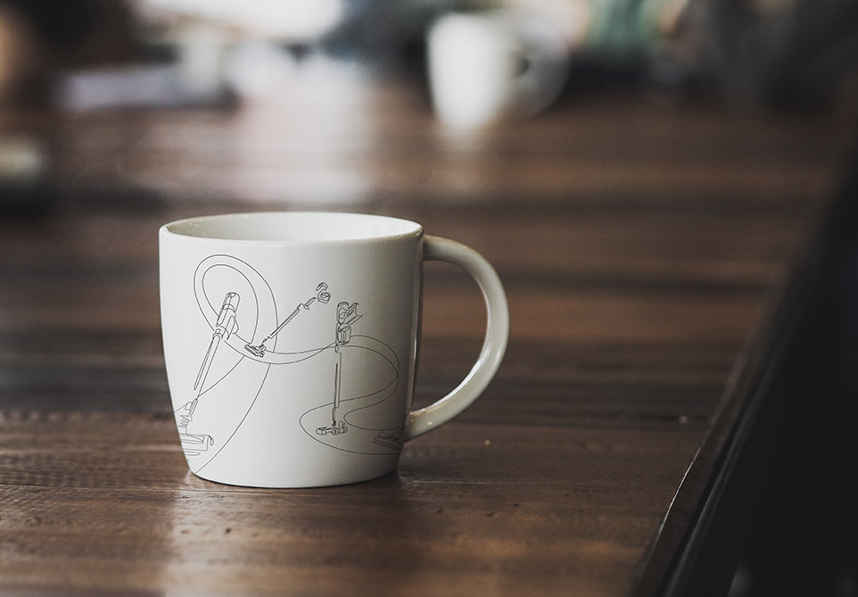 An image shows the POWERStick Pro cleaner illustration featured on a coffee mug.