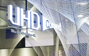 The Samsung Curved UHD TV – U9000 logo hanging at the top of the exhibition space.