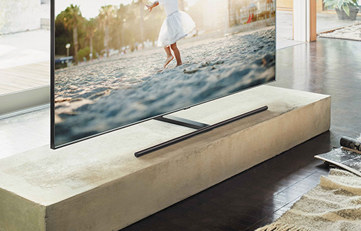 This is an image of the Samsung QLED TV placed on top of a table.