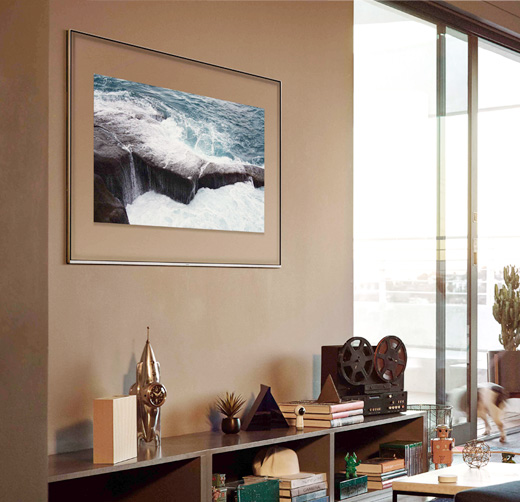This is an image of the Samsung QLED TV hanging on the wall.