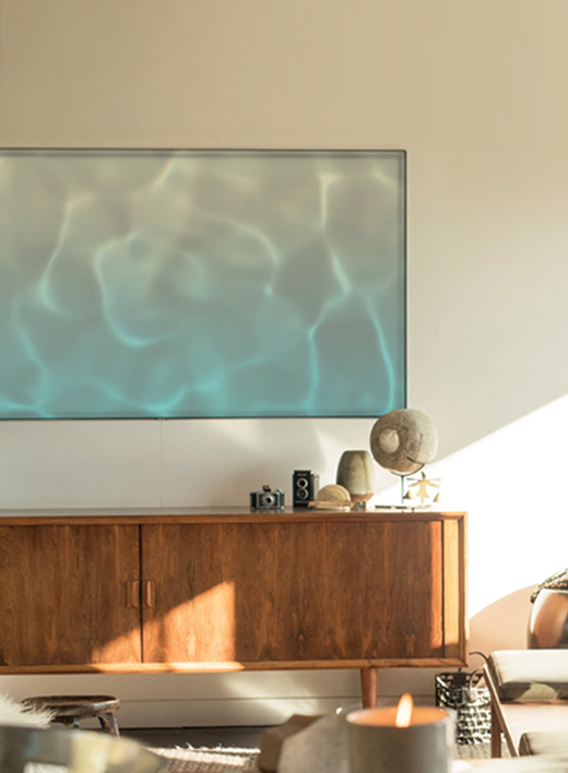 This is an image of the Samsung QLED TV hanging on the wall.