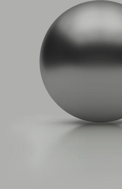 A silver sphere is resting on a floor.