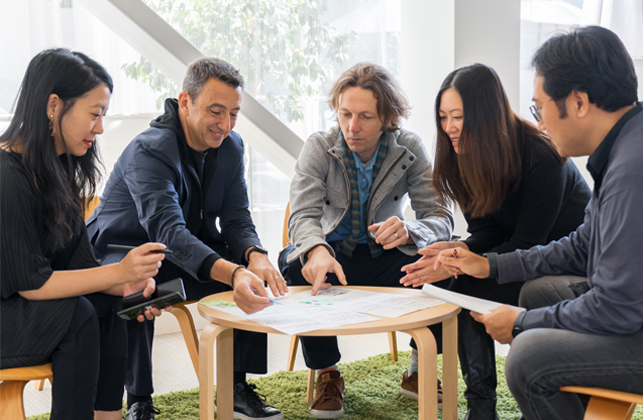 An image of SDIC staff having a meeting