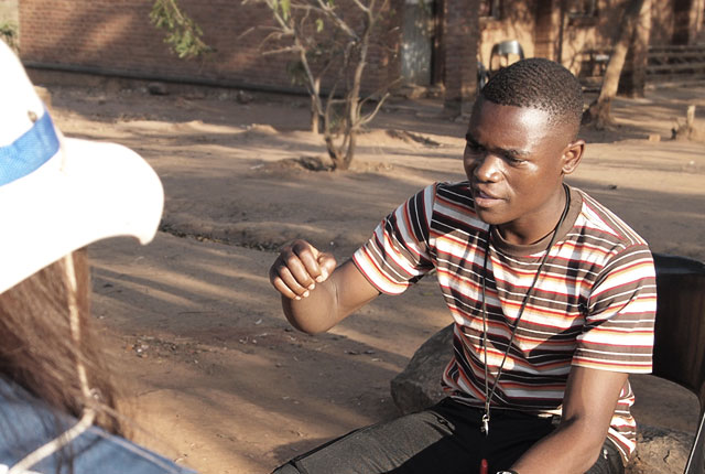 An image shows Togo Martine talking with a Samsung Employee.