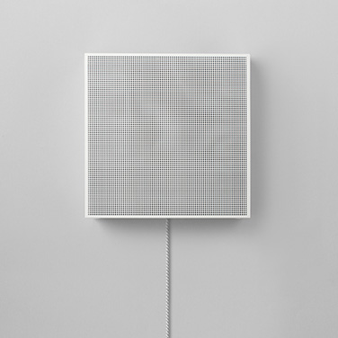 A white VL3 hangs from a wall.